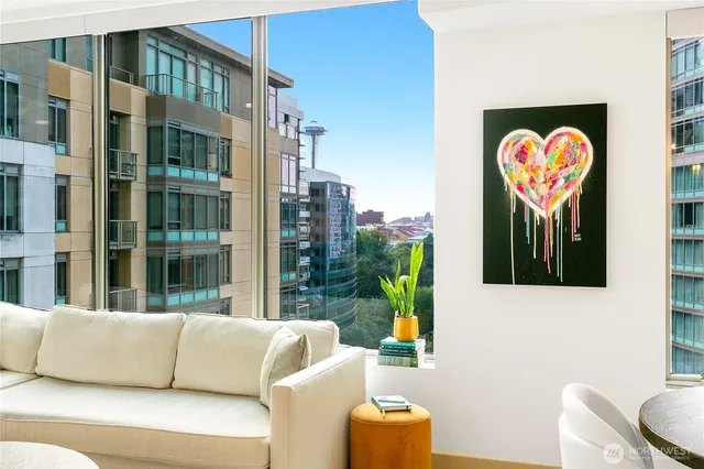 a view of living room filled with furniture and a potted plant