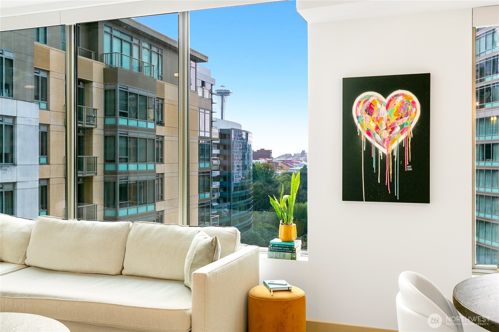 a view of living room filled with furniture and a potted plant