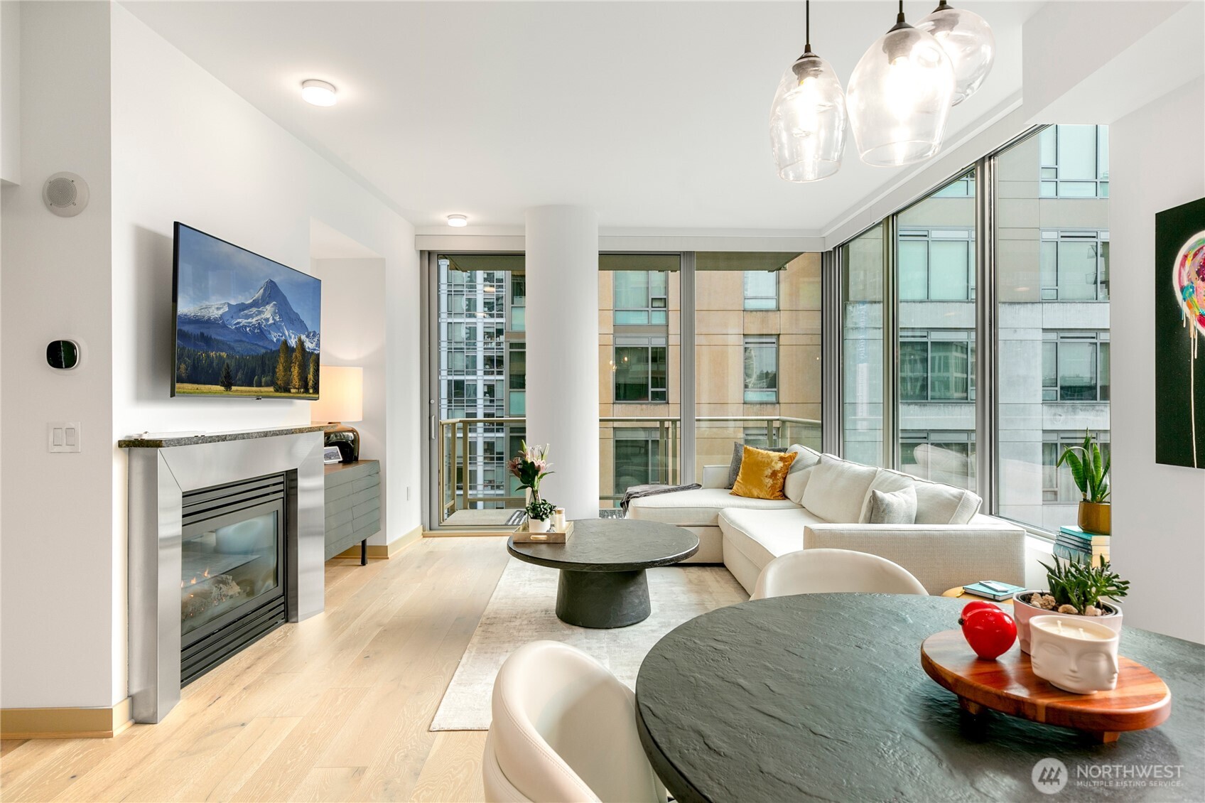 910 Lenora Street, Unit S1009 Seattle, WA 98121 - Photo 13 of 35 a living room with furniture fireplace and flat screen tv