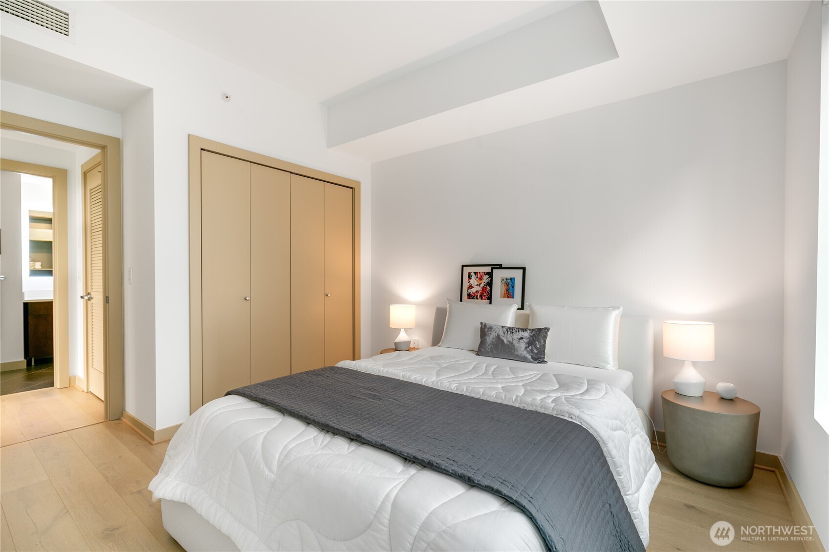 910 Lenora Street, Unit S1009 Seattle, WA 98121 - Photo 17 of 35 a bedroom with a bed and a couch