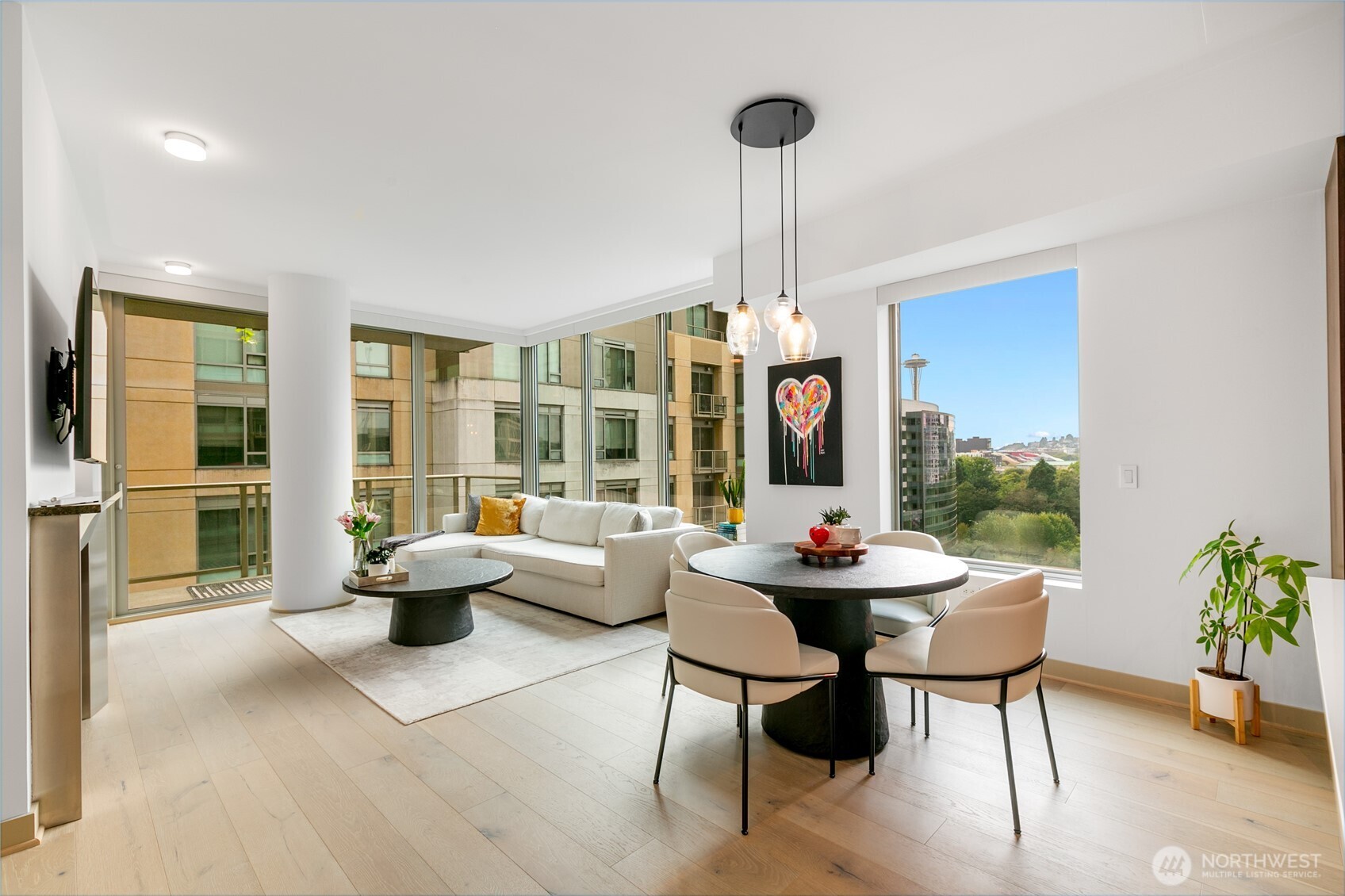 910 Lenora Street, Unit S1009 Seattle, WA 98121 - Photo 2 of 35 a dining room with furniture and wooden floor