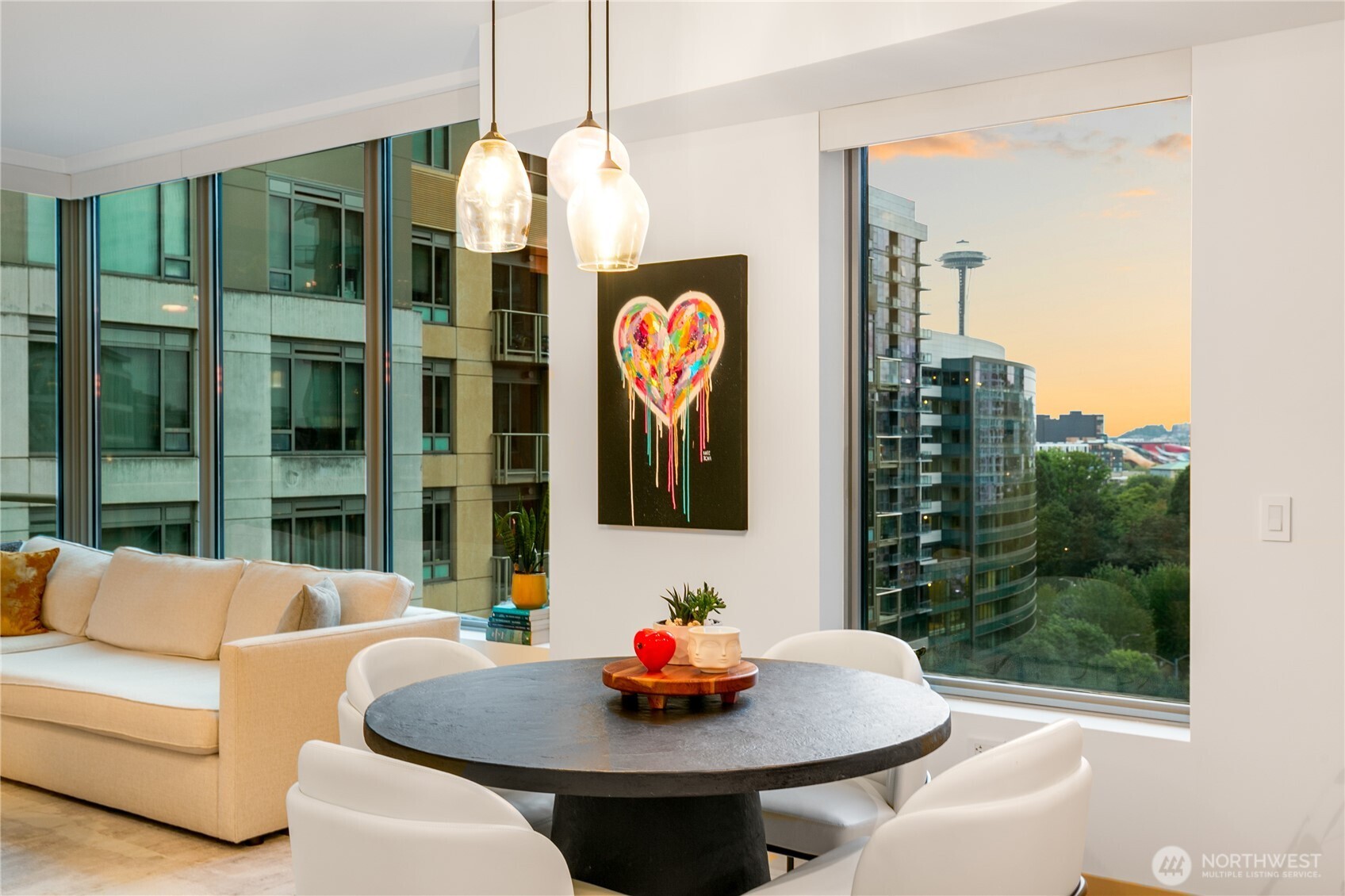 910 Lenora Street, Unit S1009 Seattle, WA 98121 - Photo 26 of 35 a living room with furniture and a chandelier