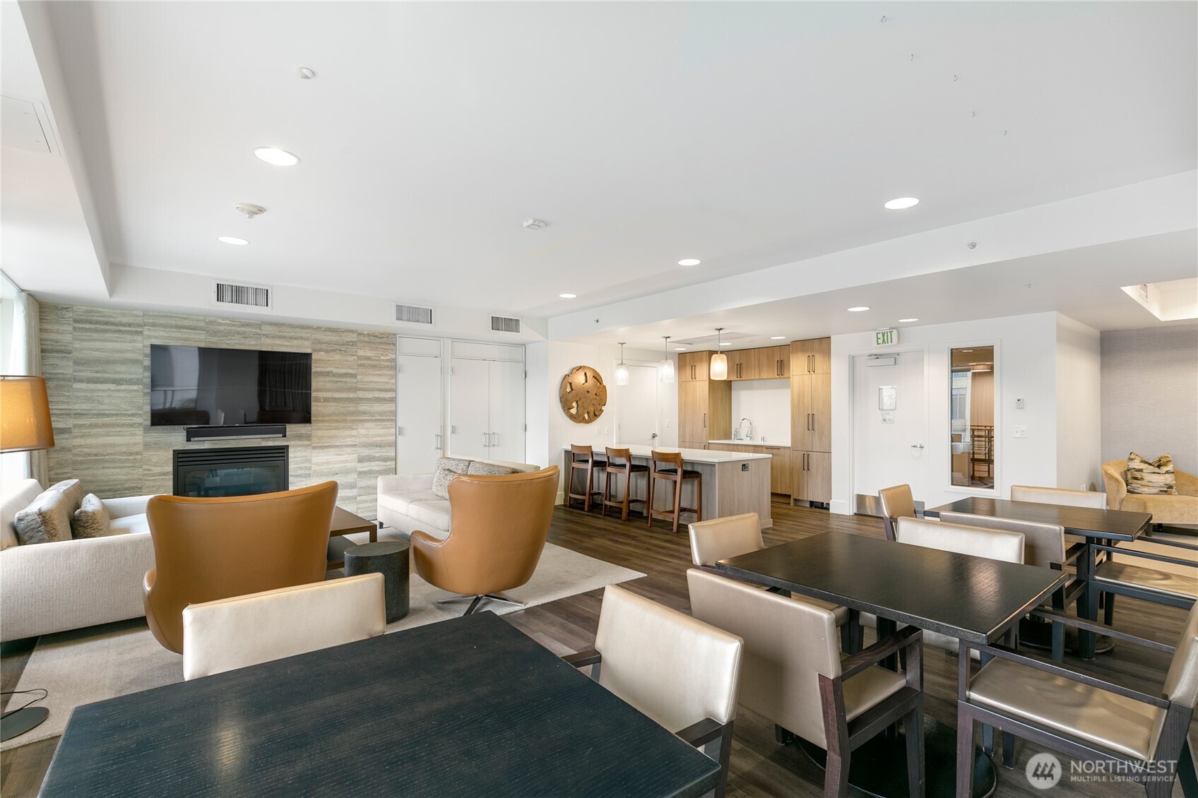 910 Lenora Street, Unit S1009 Seattle, WA 98121 - Photo 32 of 35 a living room with furniture a flat screen tv and kitchen view