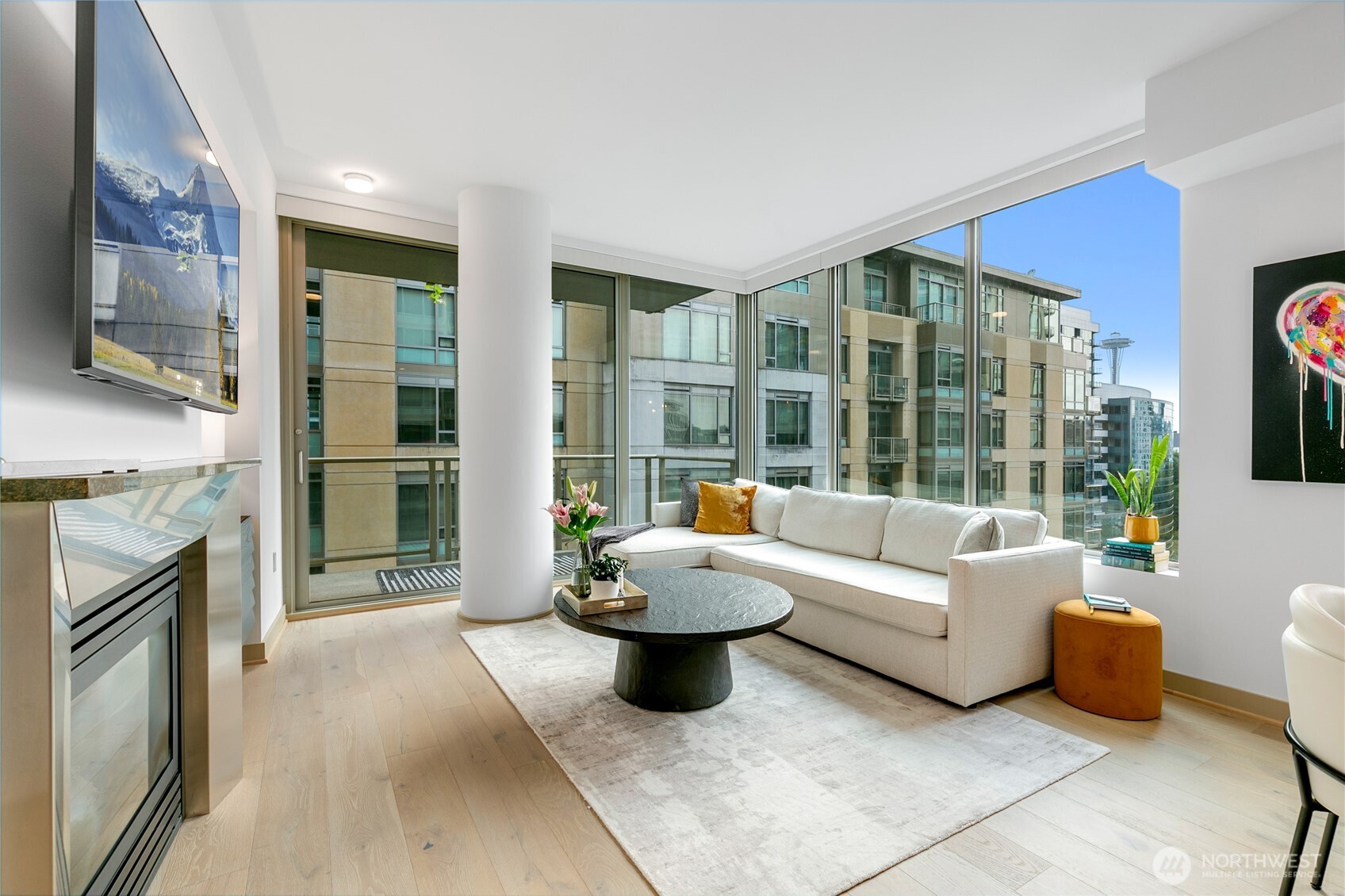 910 Lenora Street, Unit S1009 Seattle, WA 98121 - Photo 4 of 35 a living room with furniture and a floor to ceiling window
