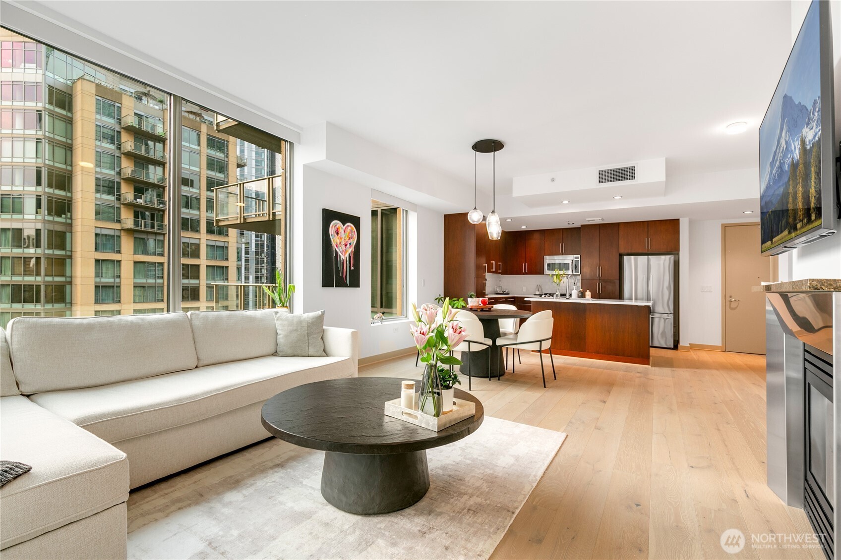 910 Lenora Street, Unit S1009 Seattle, WA 98121 - Photo 5 of 35 a living room with furniture and a large window