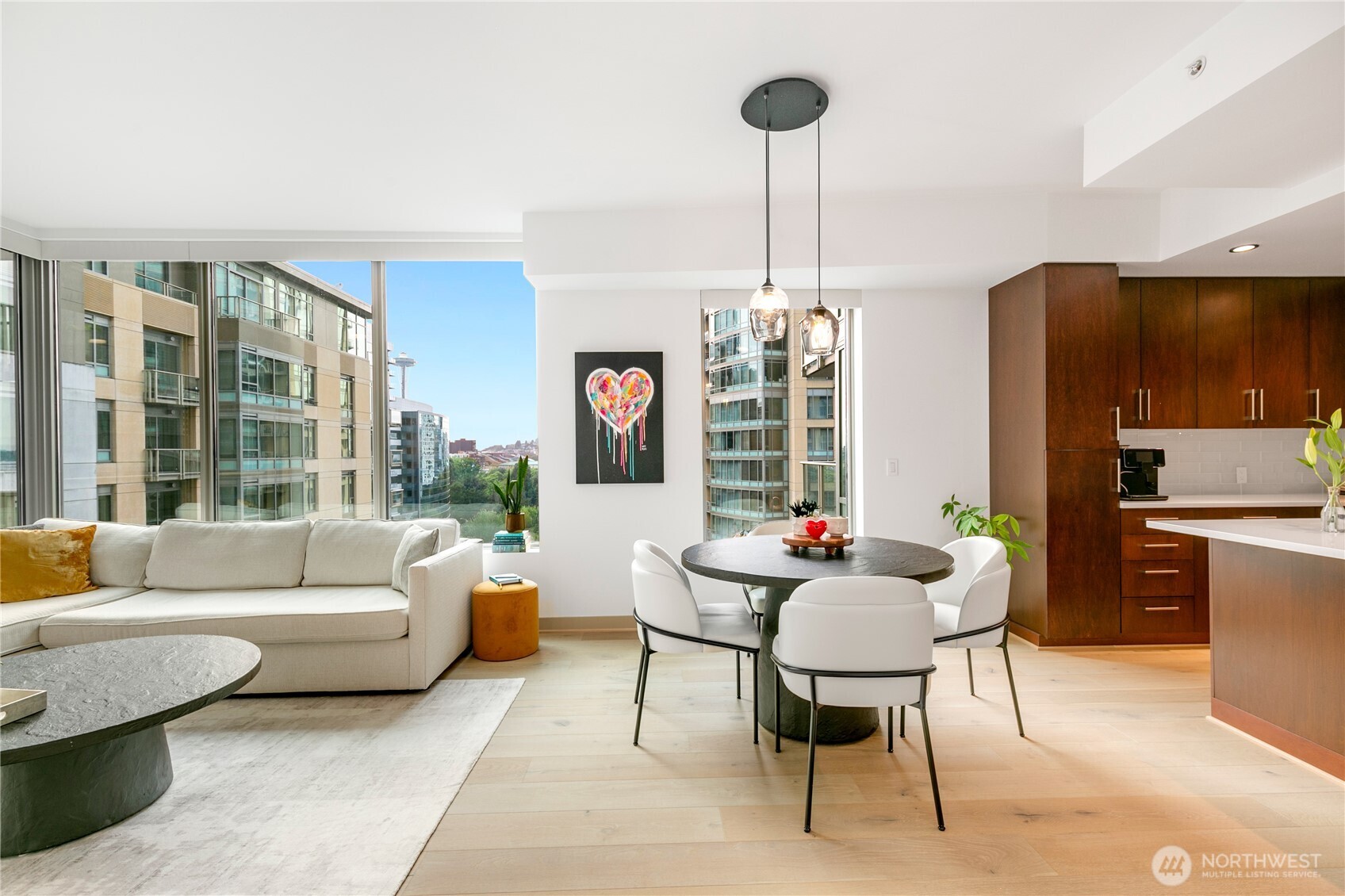910 Lenora Street, Unit S1009 Seattle, WA 98121 - Photo 6 of 35 a living room with furniture and a table
