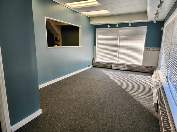 a view of a balcony with wooden floor