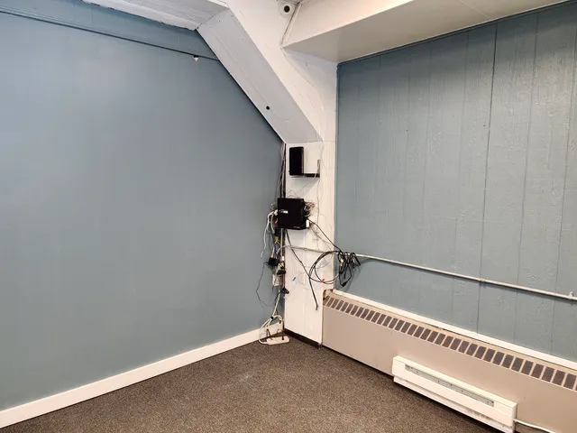 a view of an empty room with windows