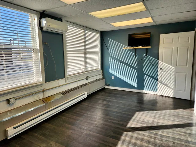 a view of an empty room with a window