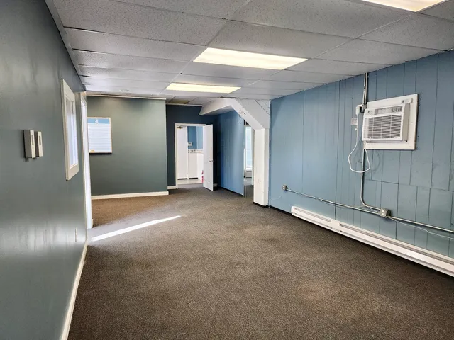 a view of a livingroom with wooden floor and closet
