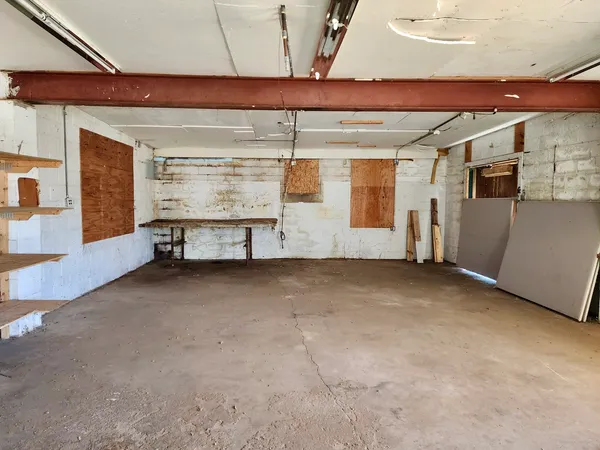 a view of a room with wooden furniture