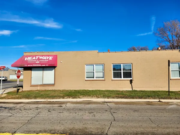 a side view of a house with a yard
