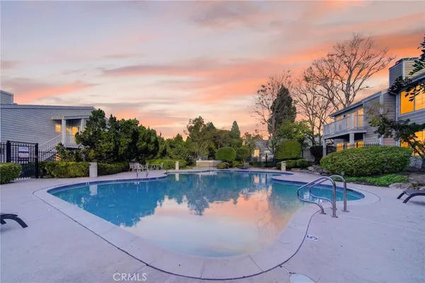 a view of a swimming pool with lounge chair