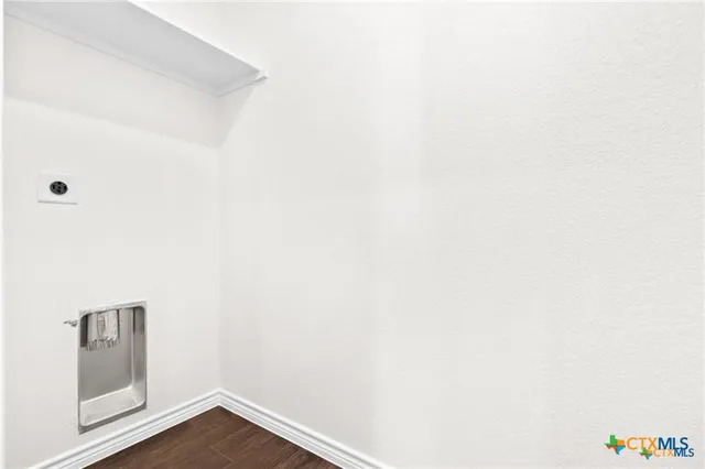 a view of a small space with wooden floor