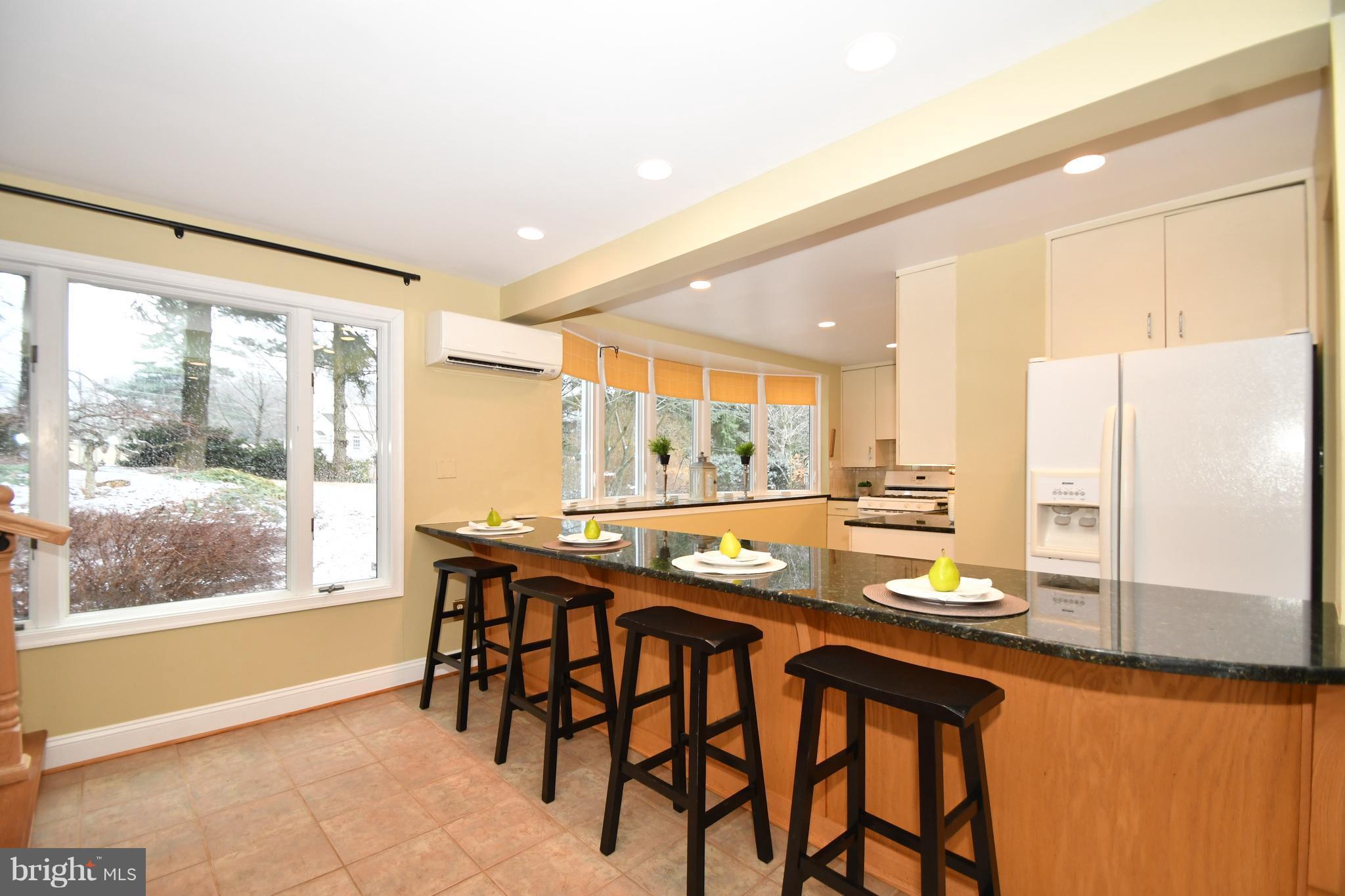 2103 Laurel Brook Road Fallston, MD 21047 - Photo 11 of 30 a kitchen with a table chairs refrigerator and cabinets