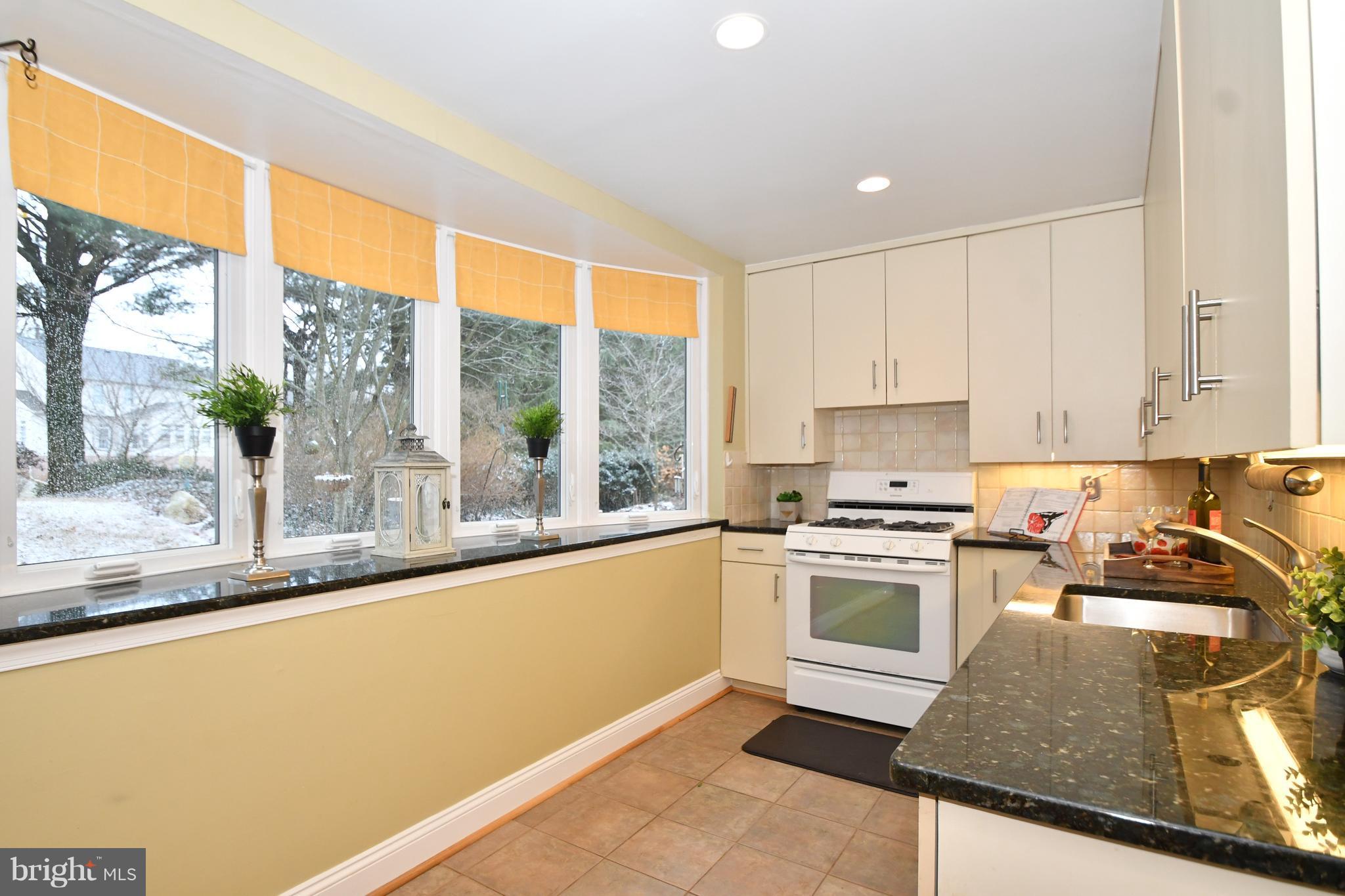 2103 Laurel Brook Road Fallston, MD 21047 - Photo 13 of 30 a kitchen with a stove a sink and a granite counter top