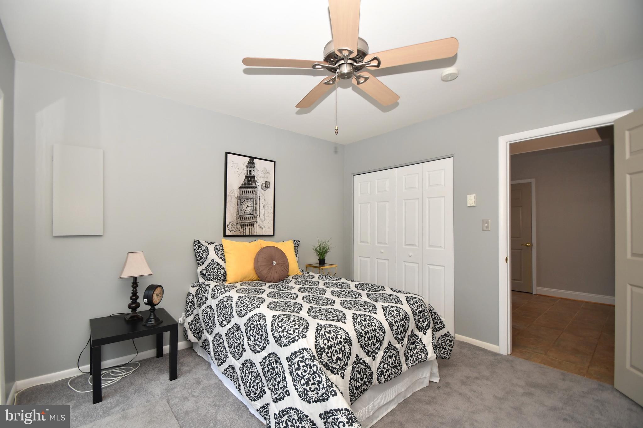 2103 Laurel Brook Road Fallston, MD 21047 - Photo 26 of 30 a bedroom with a large bed and a chandelier