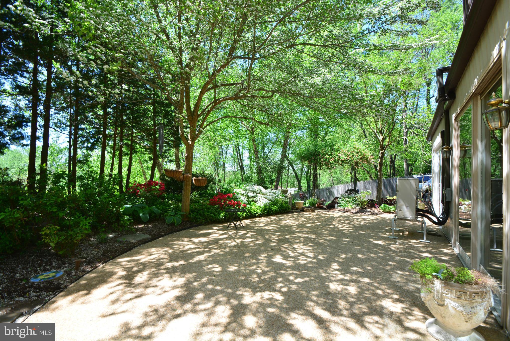 2103 Laurel Brook Road Fallston, MD 21047 - Photo 28 of 30 a view of a backyard with table and chairs and a large tree