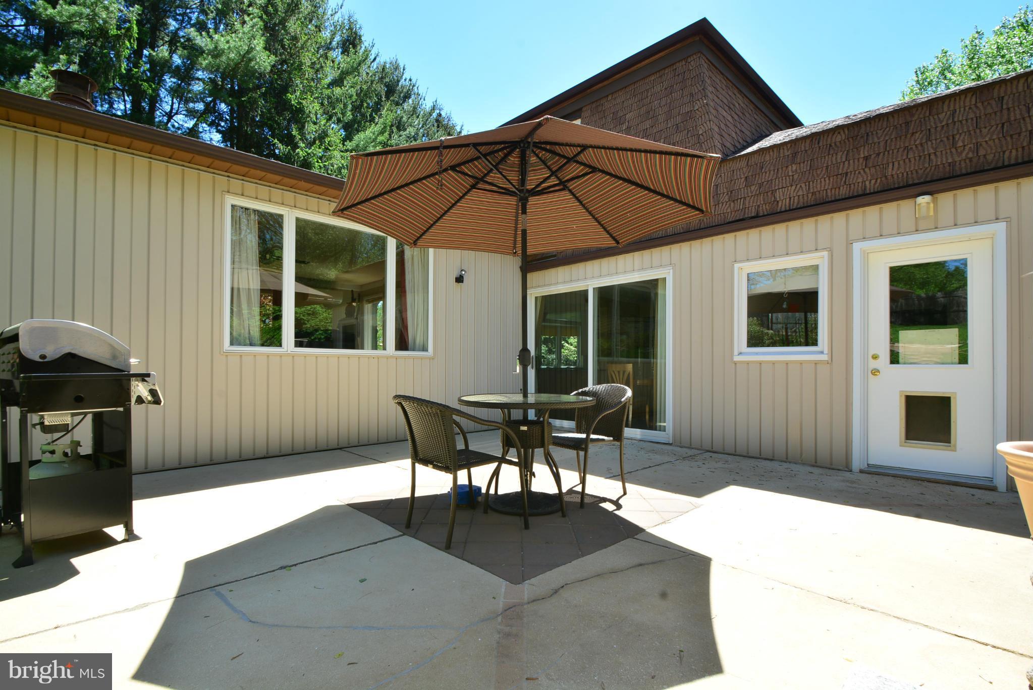 2103 Laurel Brook Road Fallston, MD 21047 - Photo 9 of 30 a backyard of a house with table and chairs