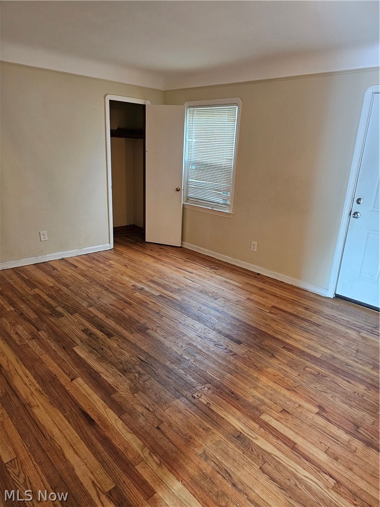 5716 Dunham Road Maple Heights, OH 44137 - Photo 5 of 9 Unfurnished bedroom featuring wood-type flooring