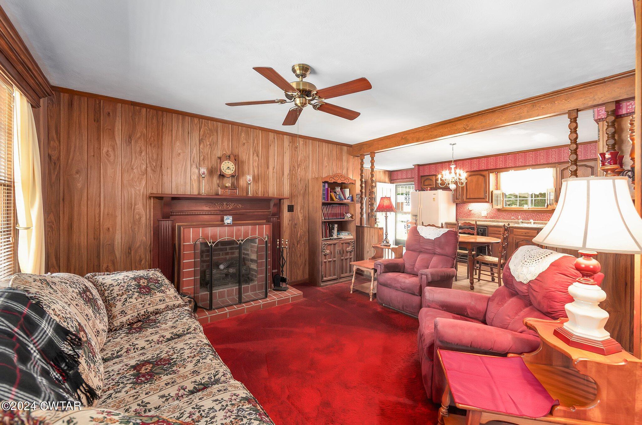 101 Hadley Drive Rutherford, TN 38369 - Photo 11 of 25 a living room with furniture a fireplace and a large window