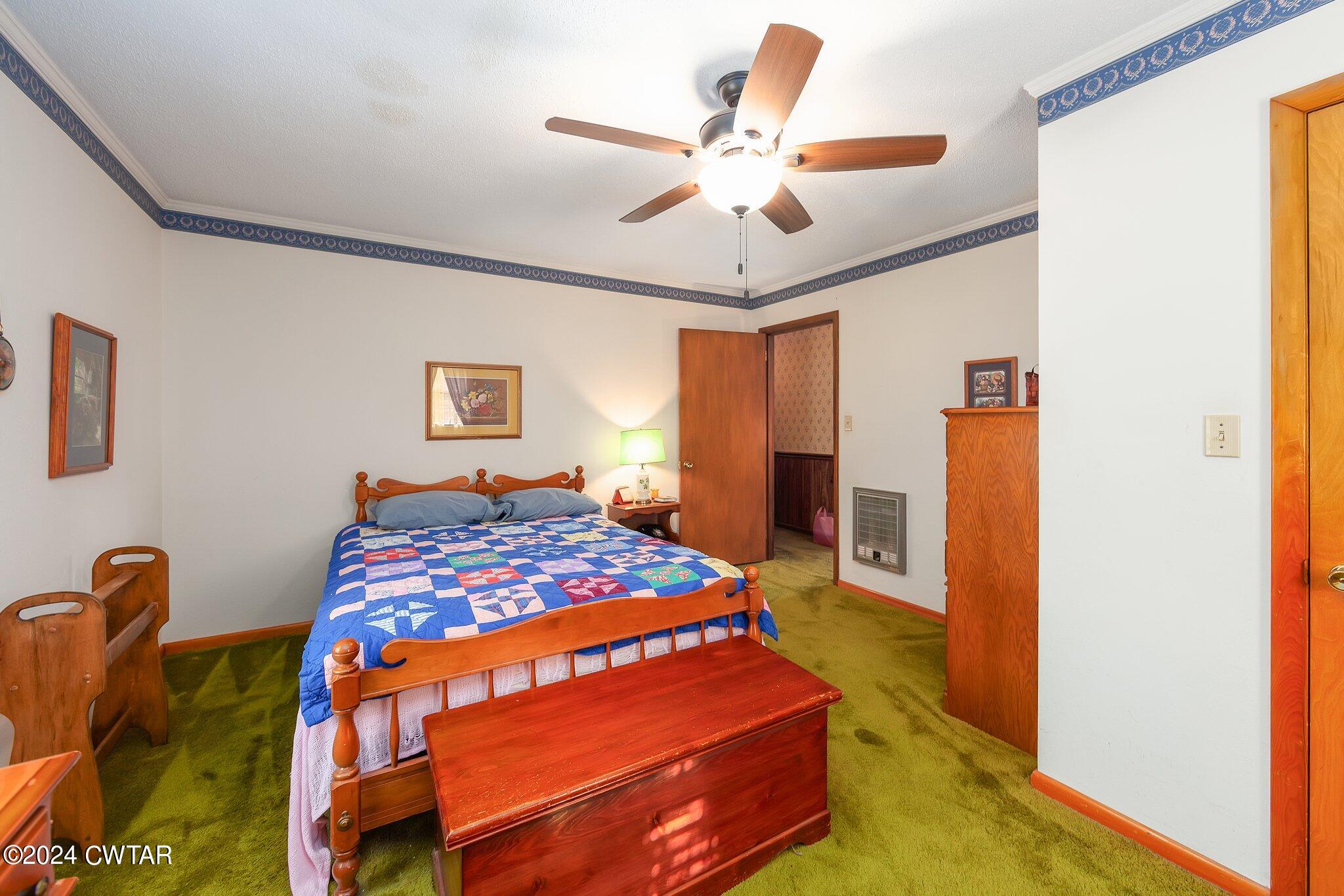 101 Hadley Drive Rutherford, TN 38369 - Photo 16 of 25 a bedroom with a bed and a chandelier
