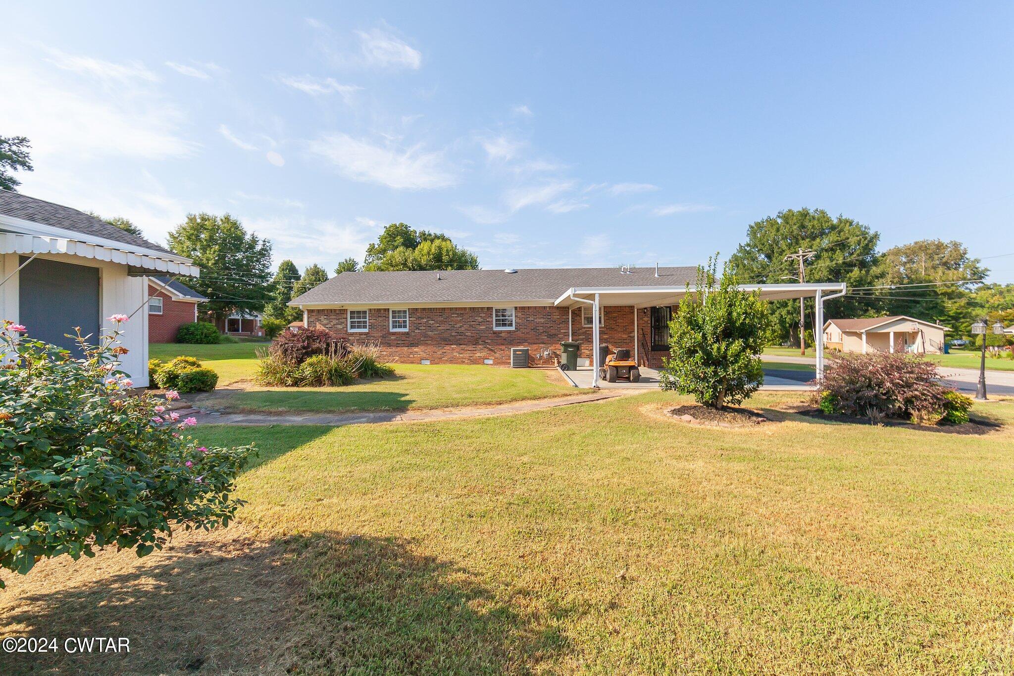 101 Hadley Drive Rutherford, TN 38369 - Photo 21 of 25 a view of a house with swimming pool and a yard