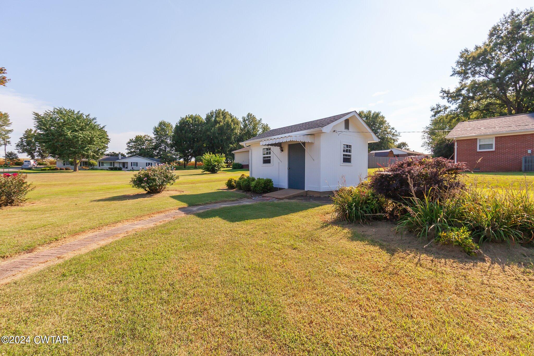 101 Hadley Drive Rutherford, TN 38369 - Photo 22 of 25 a view of a house with pool and a yard