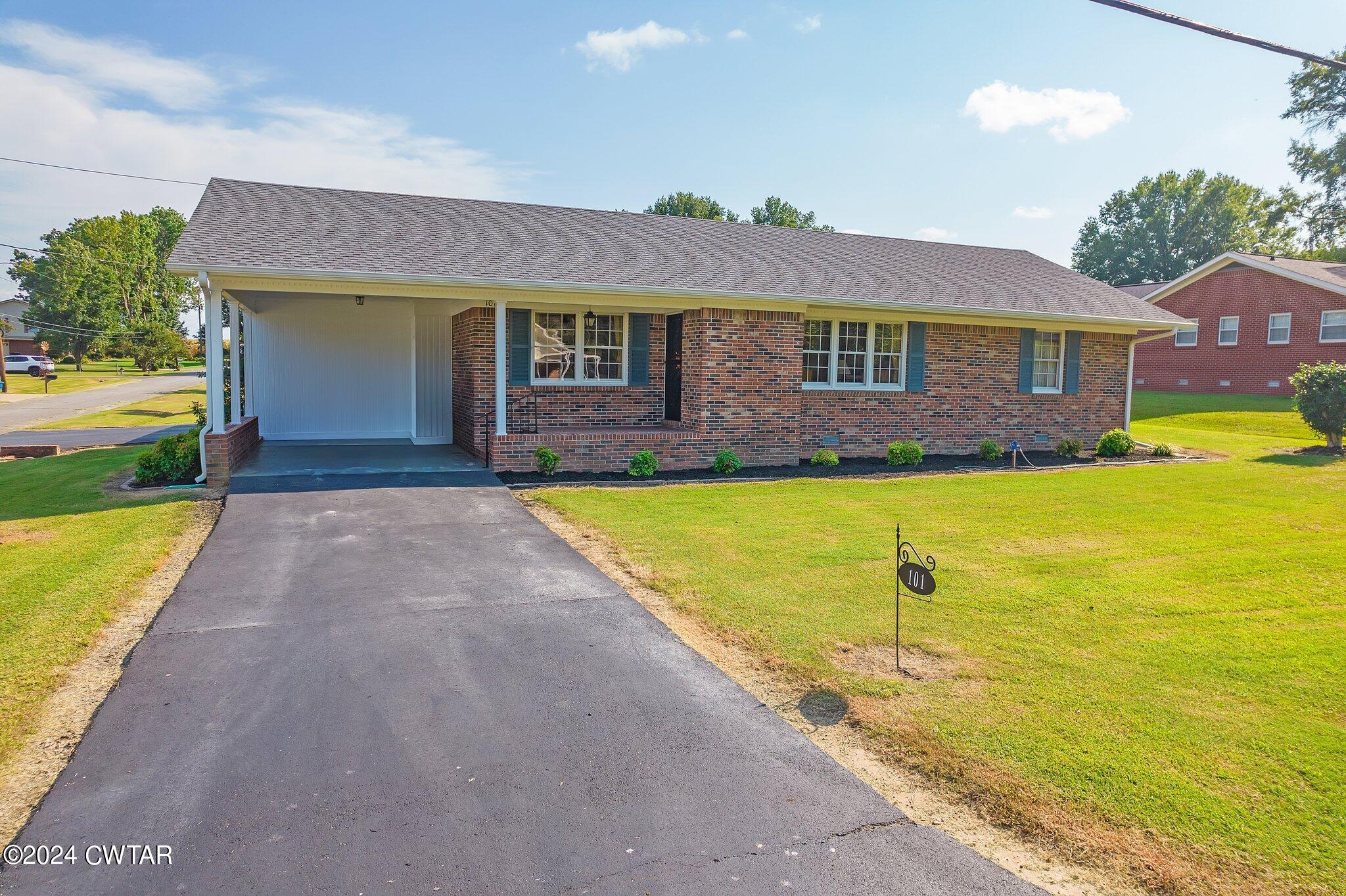 101 Hadley Drive Rutherford, TN 38369 - Photo 3 of 25 a view of an house with swimming pool and a yard