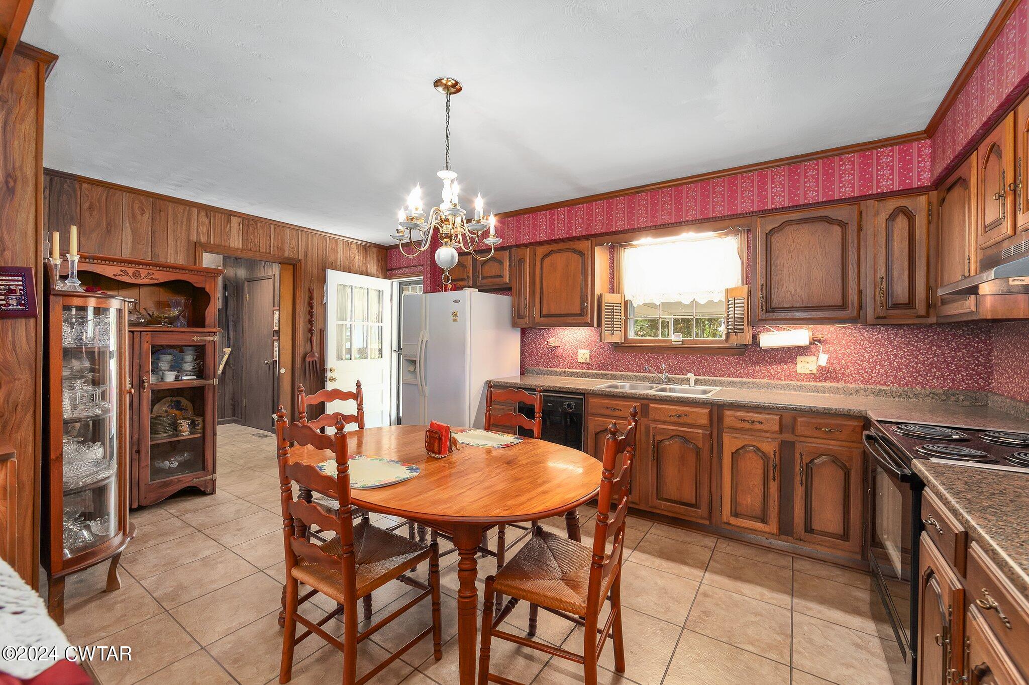 101 Hadley Drive Rutherford, TN 38369 - Photo 6 of 25 a kitchen with stainless steel appliances granite countertop a kitchen island hardwood floor a dining table and chairs