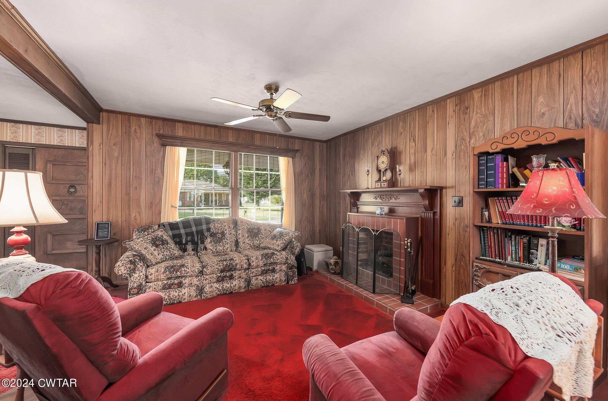101 Hadley Drive Rutherford, TN 38369 - Photo 8 of 25 a living room with furniture a large window and a chandelier
