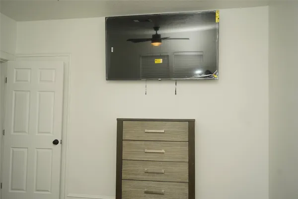 a bathroom with a shower and a mirror