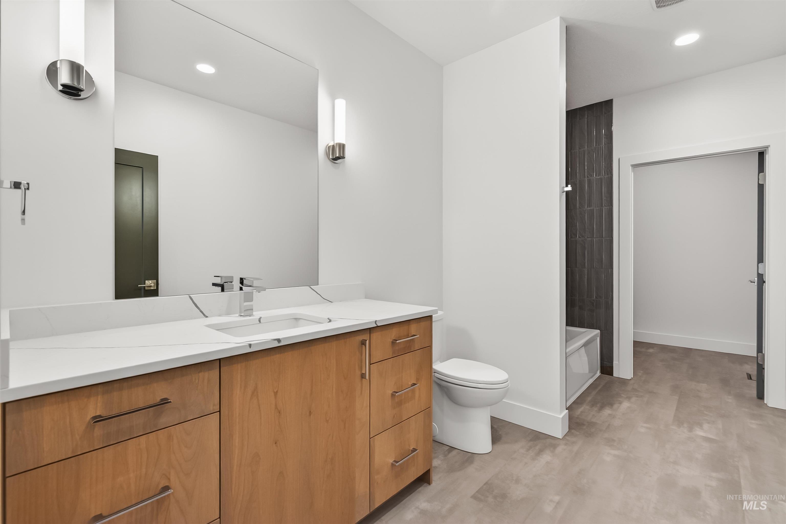 3710 22nd Street Lewiston, ID 83501 - Photo 9 of 36 Full bath with vanity, recessed lighting, light wood finished floors, and a tub