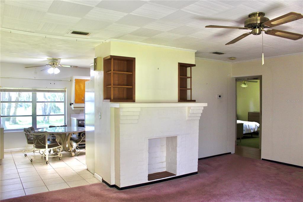 407 Hunting Lodge Drive Inverness, FL 34453 - Photo 9 of 16 a view of a livingroom with furniture and a flat screen tv