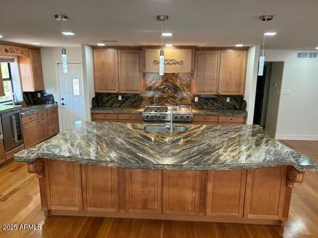 a view of a kitchen with a sink and a stove