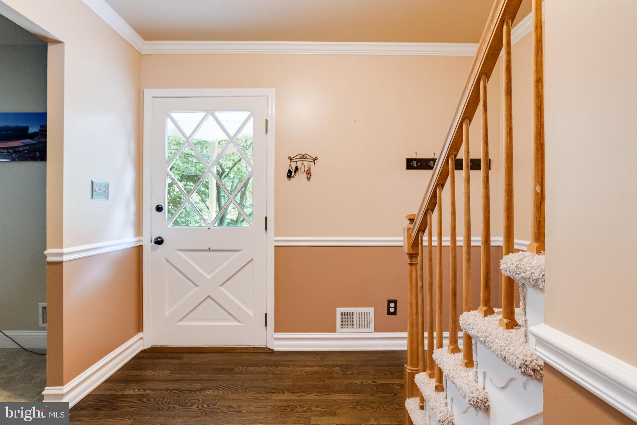 506 Red Pump Road Bel Air, MD 21014 - Photo 8 of 70 Crown molding and chair rail in the entryway