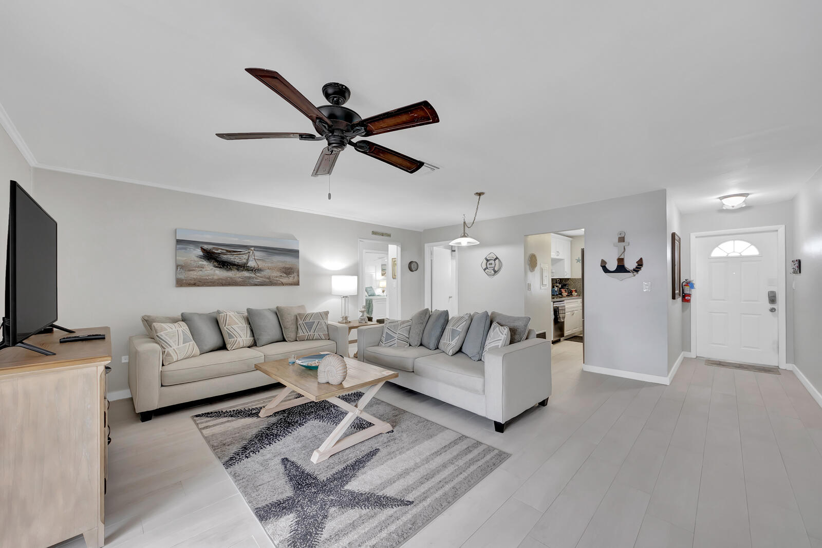 308 Sombrero Beach Road, Unit 1 & 3 Marathon, FL 33050 - Photo 11 of 36 a living room with furniture and a flat screen tv