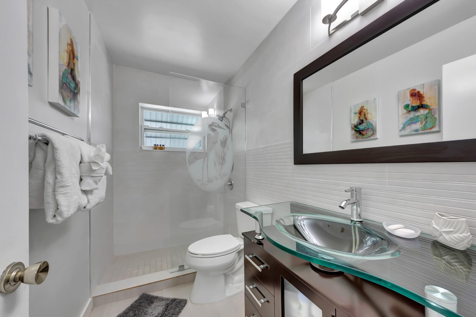 308 Sombrero Beach Road, Unit 1 & 3 Marathon, FL 33050 - Photo 14 of 36 a bathroom with a granite countertop sink a toilet and a shower