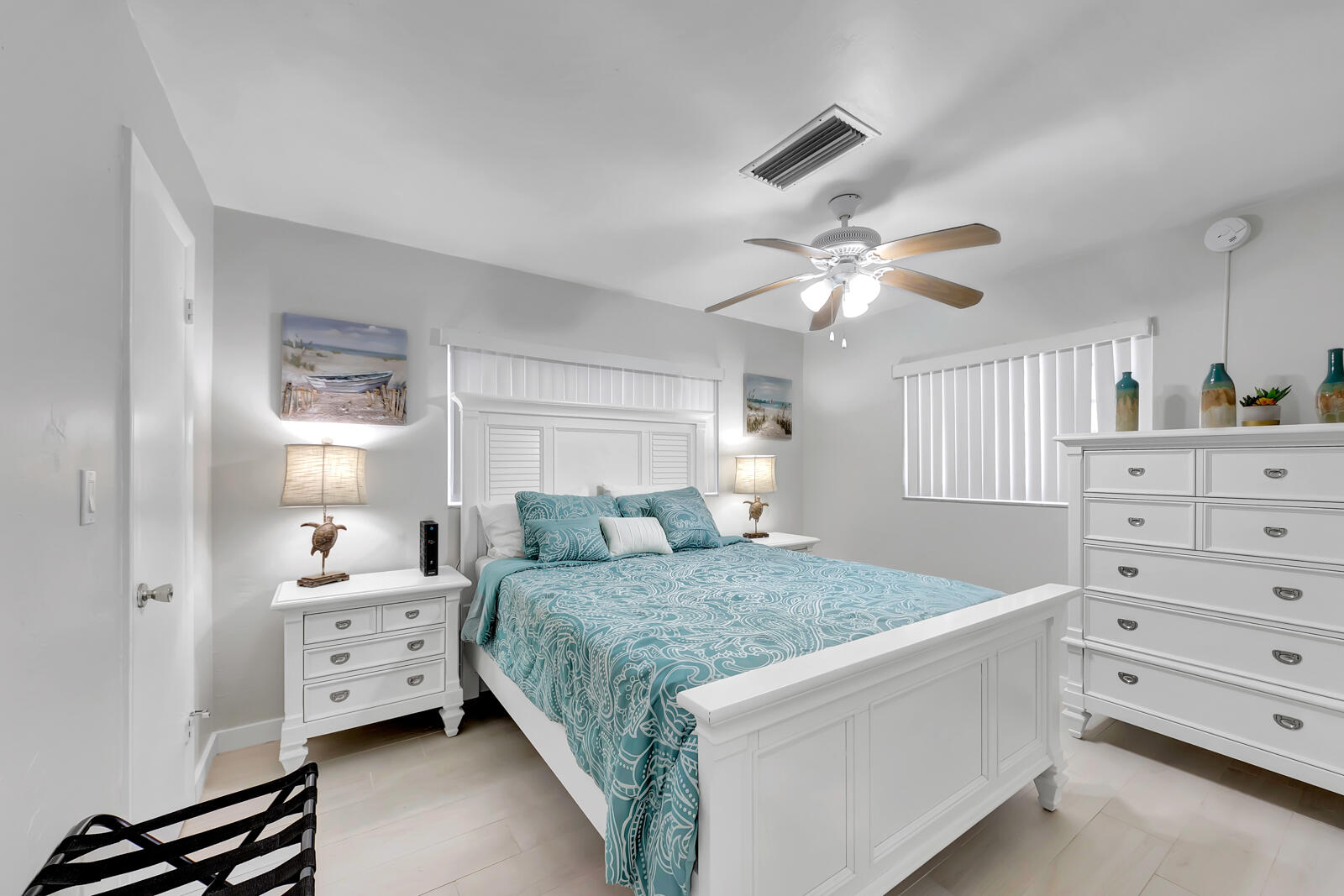 308 Sombrero Beach Road, Unit 1 & 3 Marathon, FL 33050 - Photo 15 of 36 a bedroom with a large bed and a chandelier