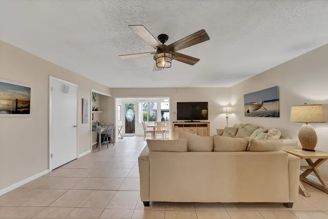 a living room with furniture and flat screen tv