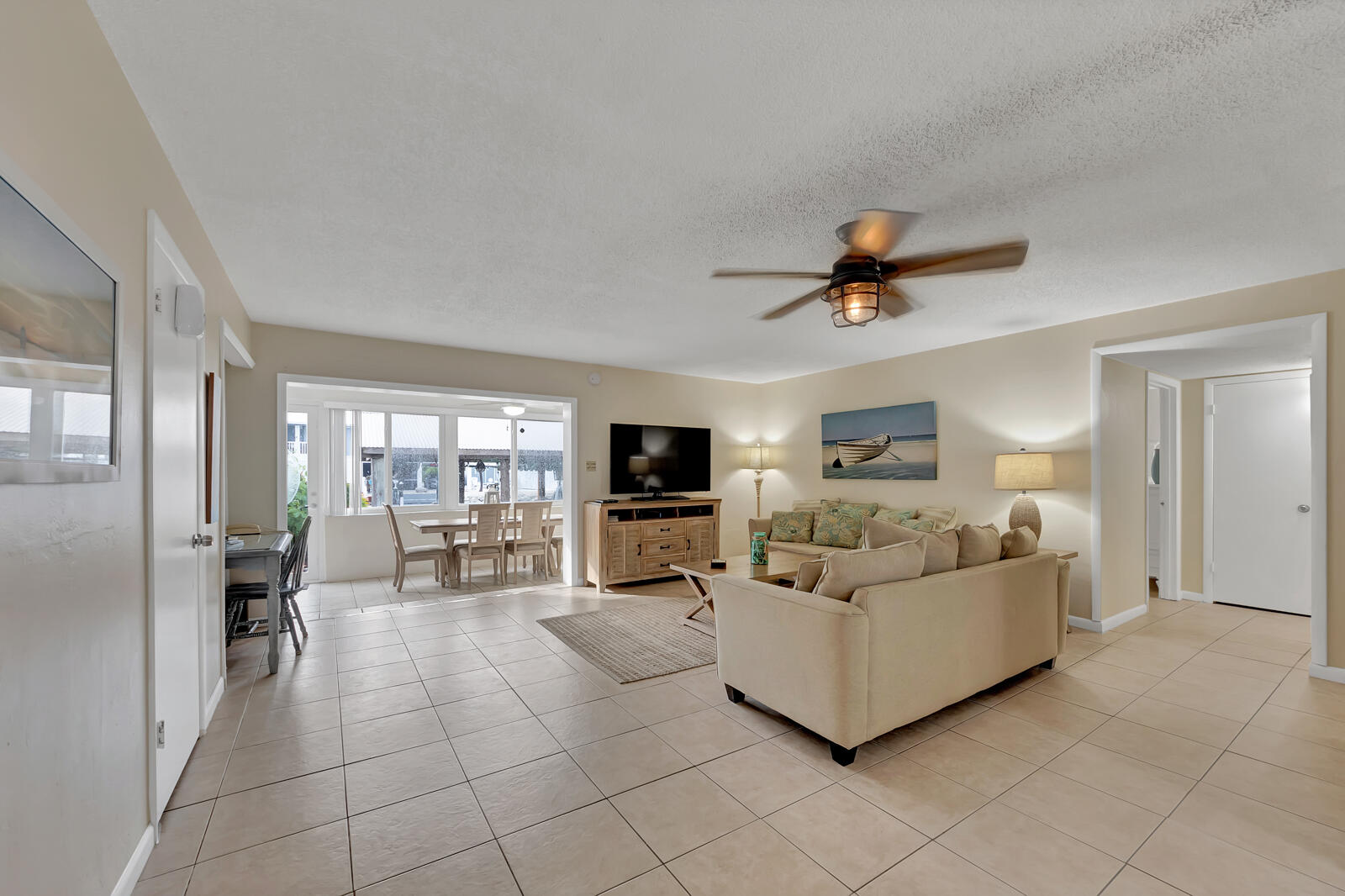 308 Sombrero Beach Road, Unit 1 & 3 Marathon, FL 33050 - Photo 22 of 36 a living room with furniture and flat screen tv