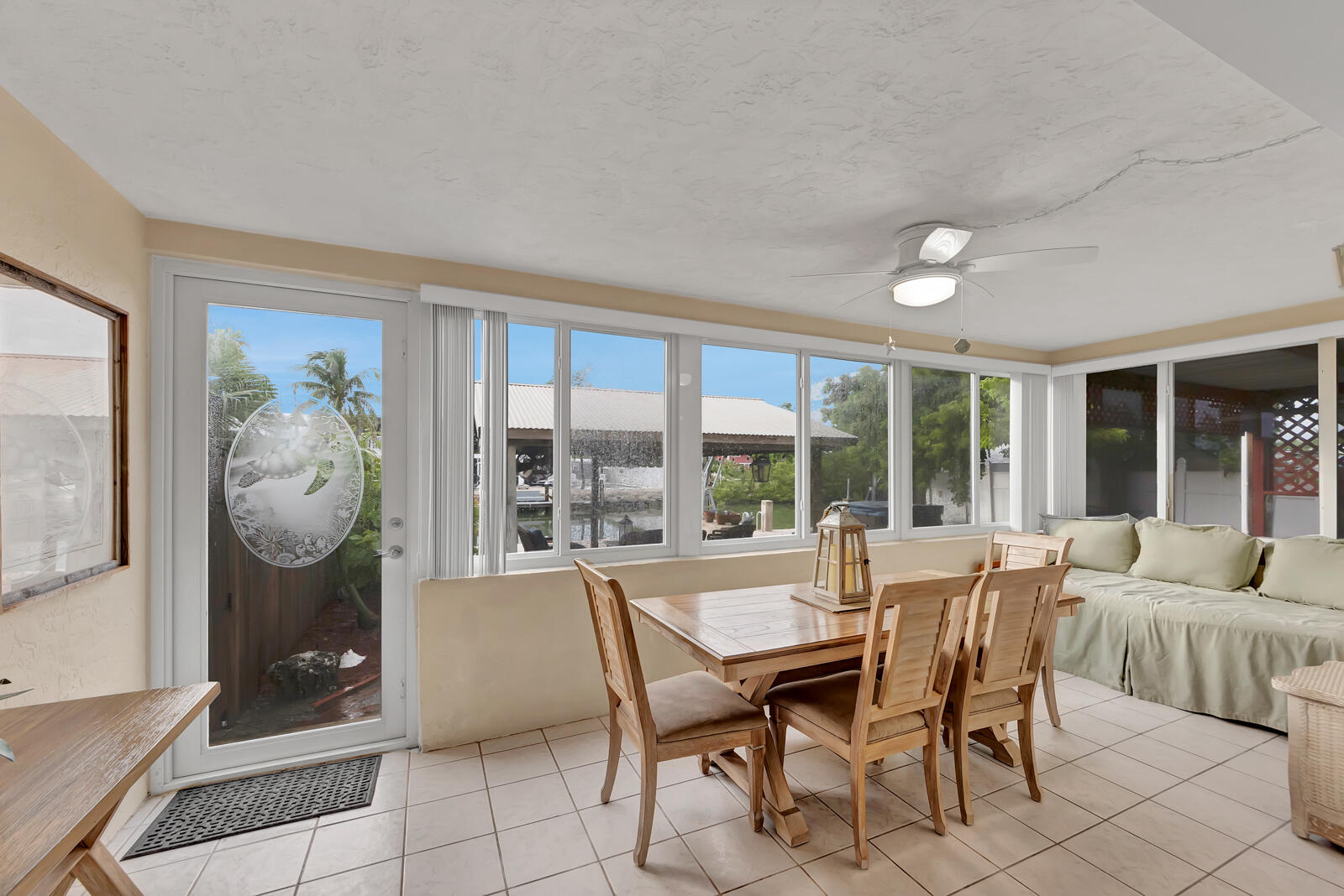 308 Sombrero Beach Road, Unit 1 & 3 Marathon, FL 33050 - Photo 23 of 36 a dining room with furniture and large window