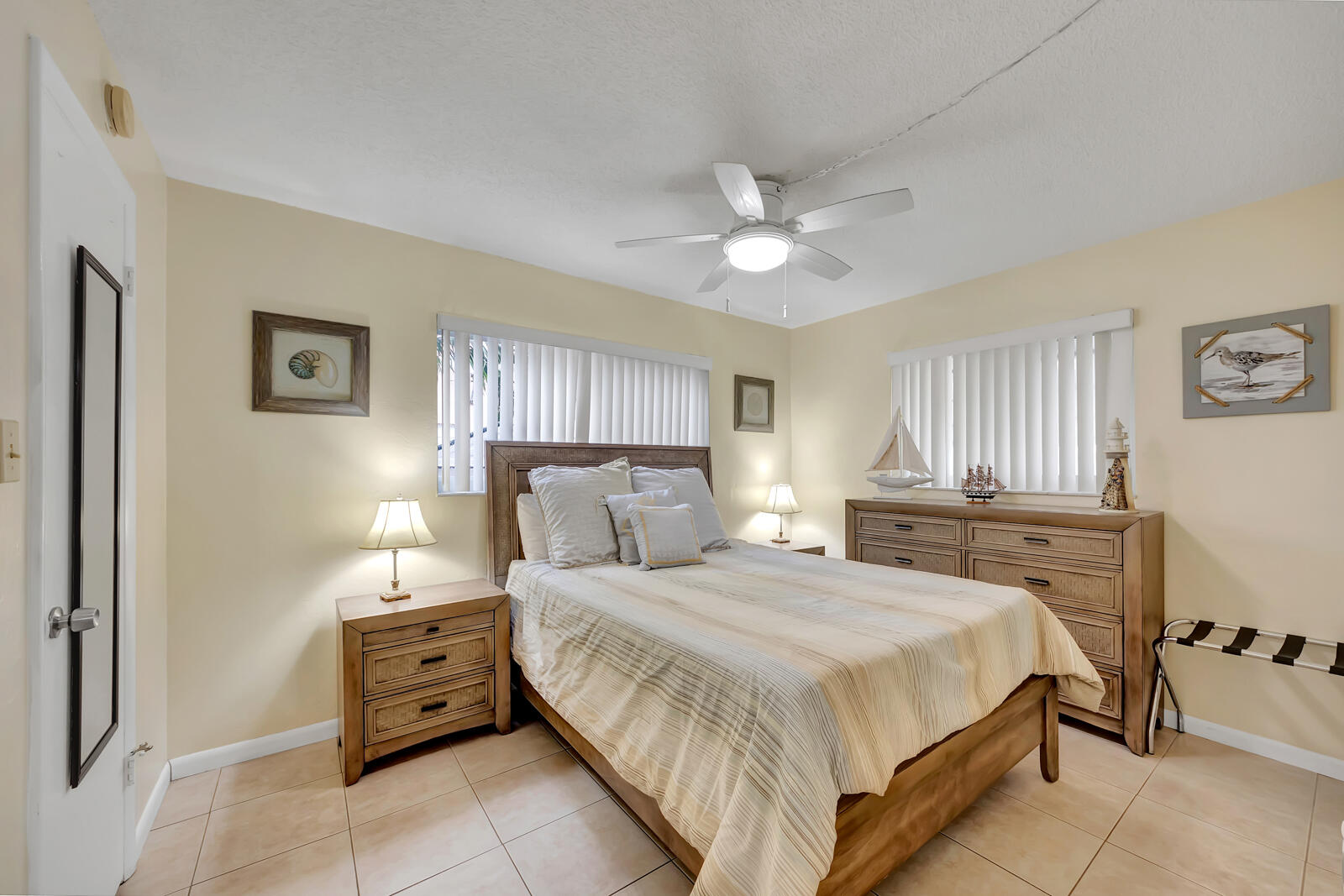 308 Sombrero Beach Road, Unit 1 & 3 Marathon, FL 33050 - Photo 26 of 36 a bedroom with a bed and a chandelier