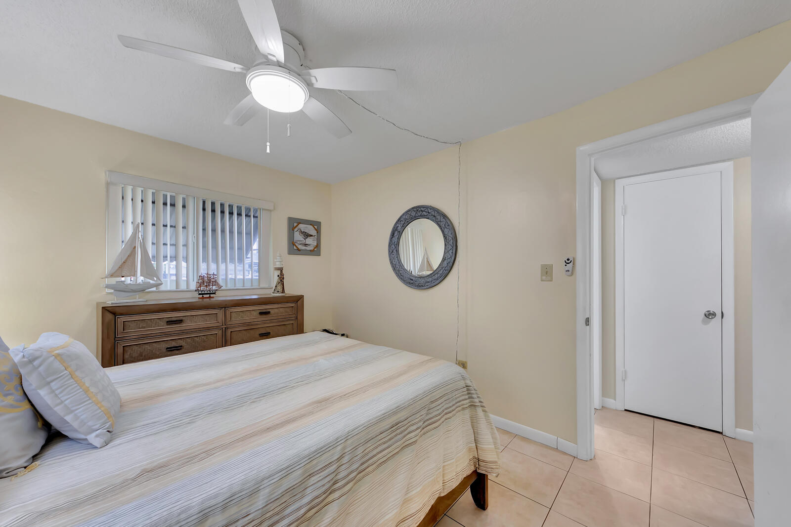 308 Sombrero Beach Road, Unit 1 & 3 Marathon, FL 33050 - Photo 27 of 36 a bedroom with a bed and a chandelier
