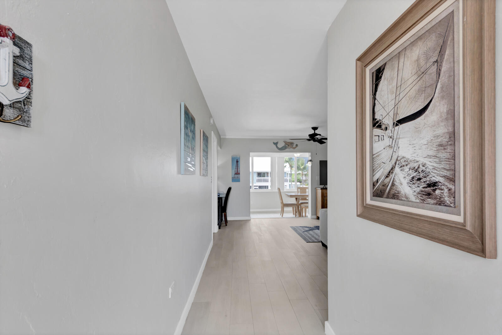 308 Sombrero Beach Road, Unit 1 & 3 Marathon, FL 33050 - Photo 3 of 36 a view of a hallway with wooden floor and closet