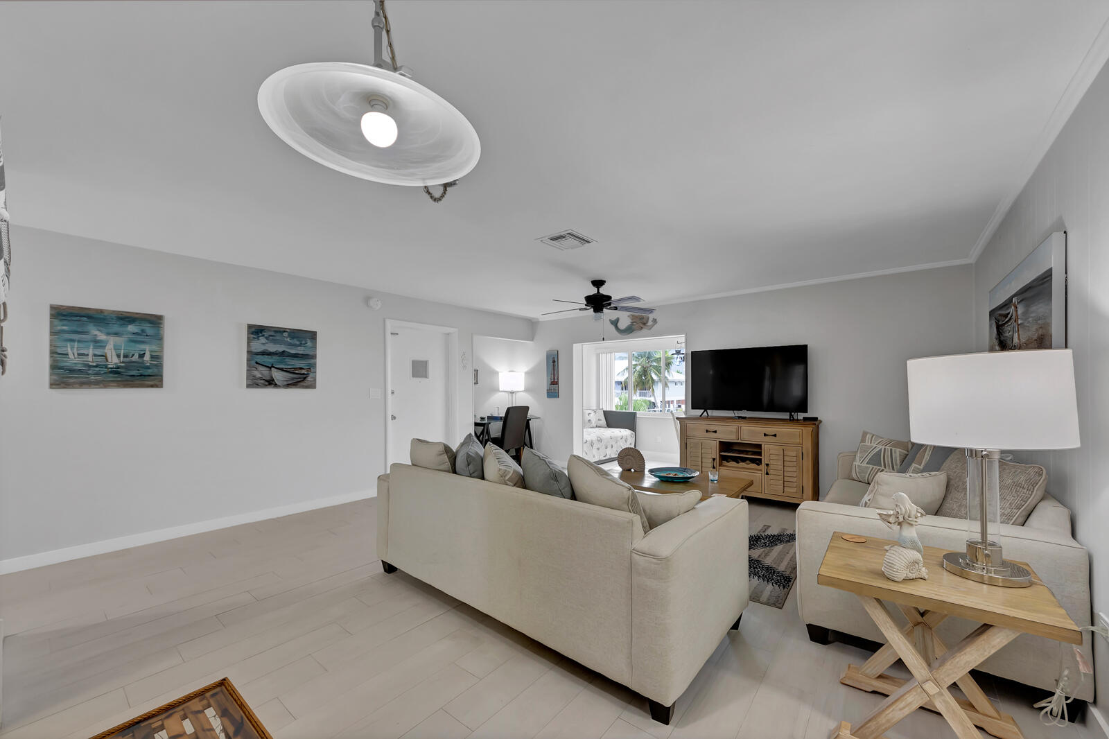 308 Sombrero Beach Road, Unit 1 & 3 Marathon, FL 33050 - Photo 6 of 36 a living room with furniture and a flat screen tv