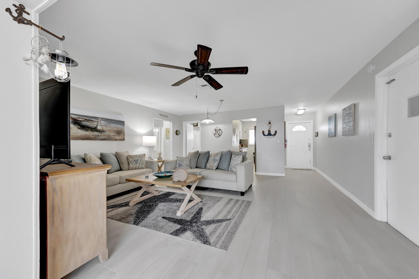 308 Sombrero Beach Road, Unit 1 & 3 Marathon, FL 33050 - Photo 10 of 36 a living room with furniture and a ceiling fan