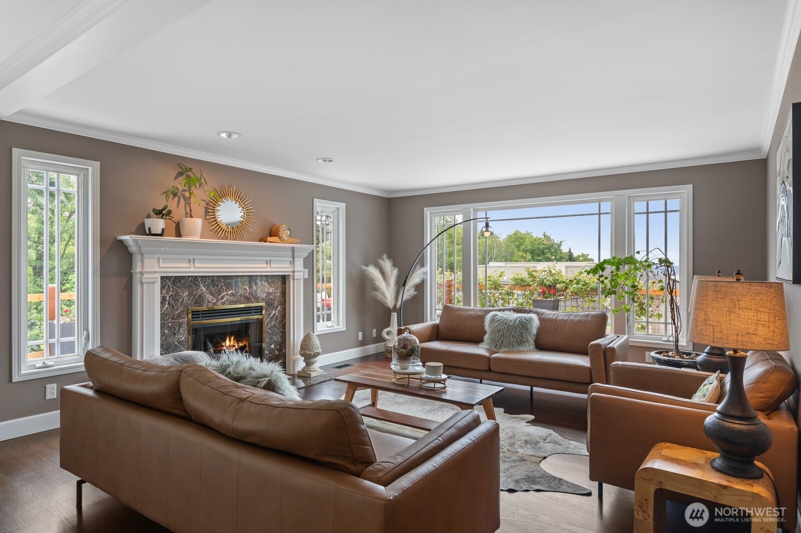 11404 239th Place Southwest Woodway, WA 98020 - Photo 11 of 40 a living room with furniture and a fireplace