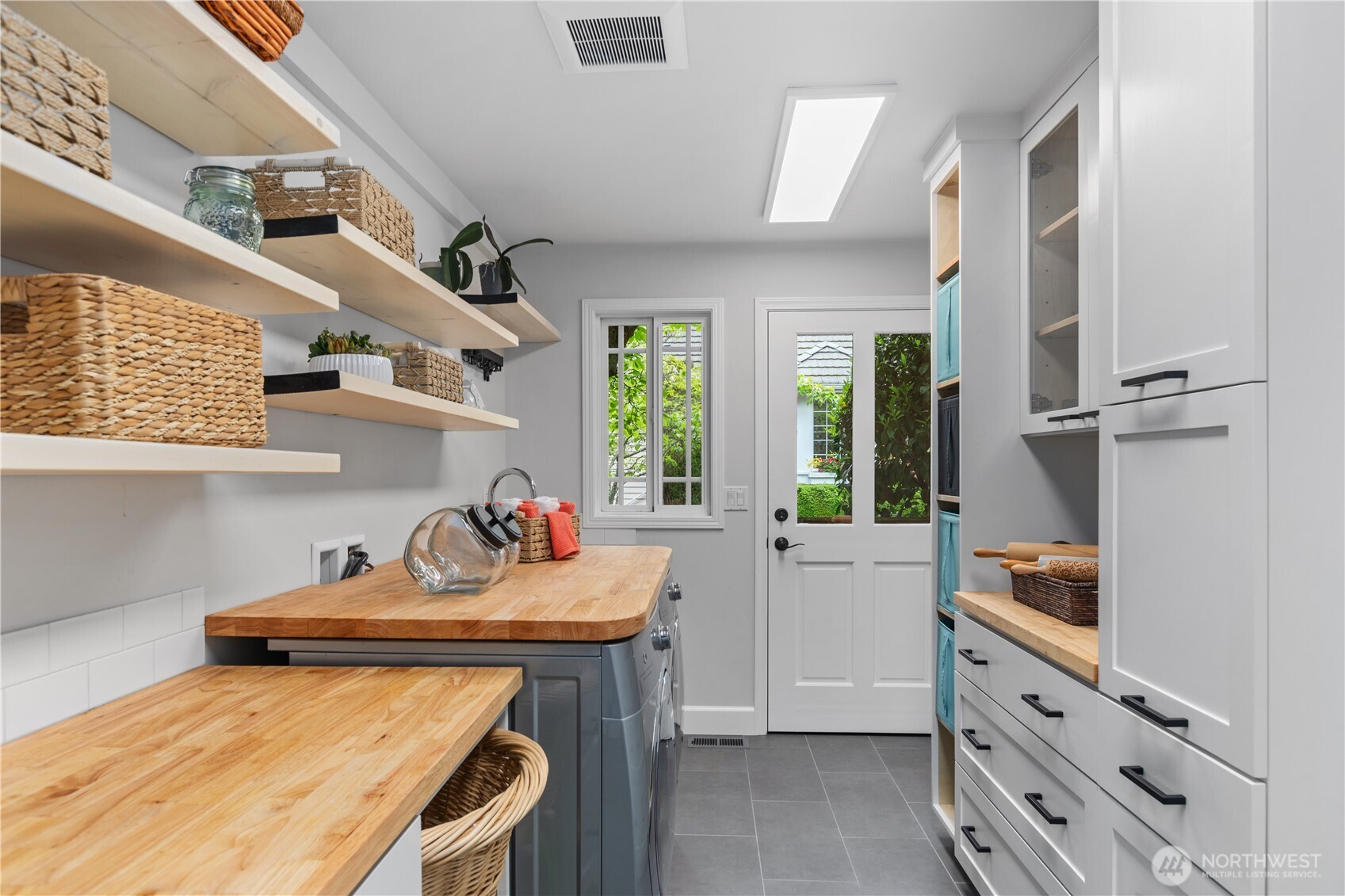 11404 239th Place Southwest Woodway, WA 98020 - Photo 14 of 40 a kitchen that has a lot of cabinets in it