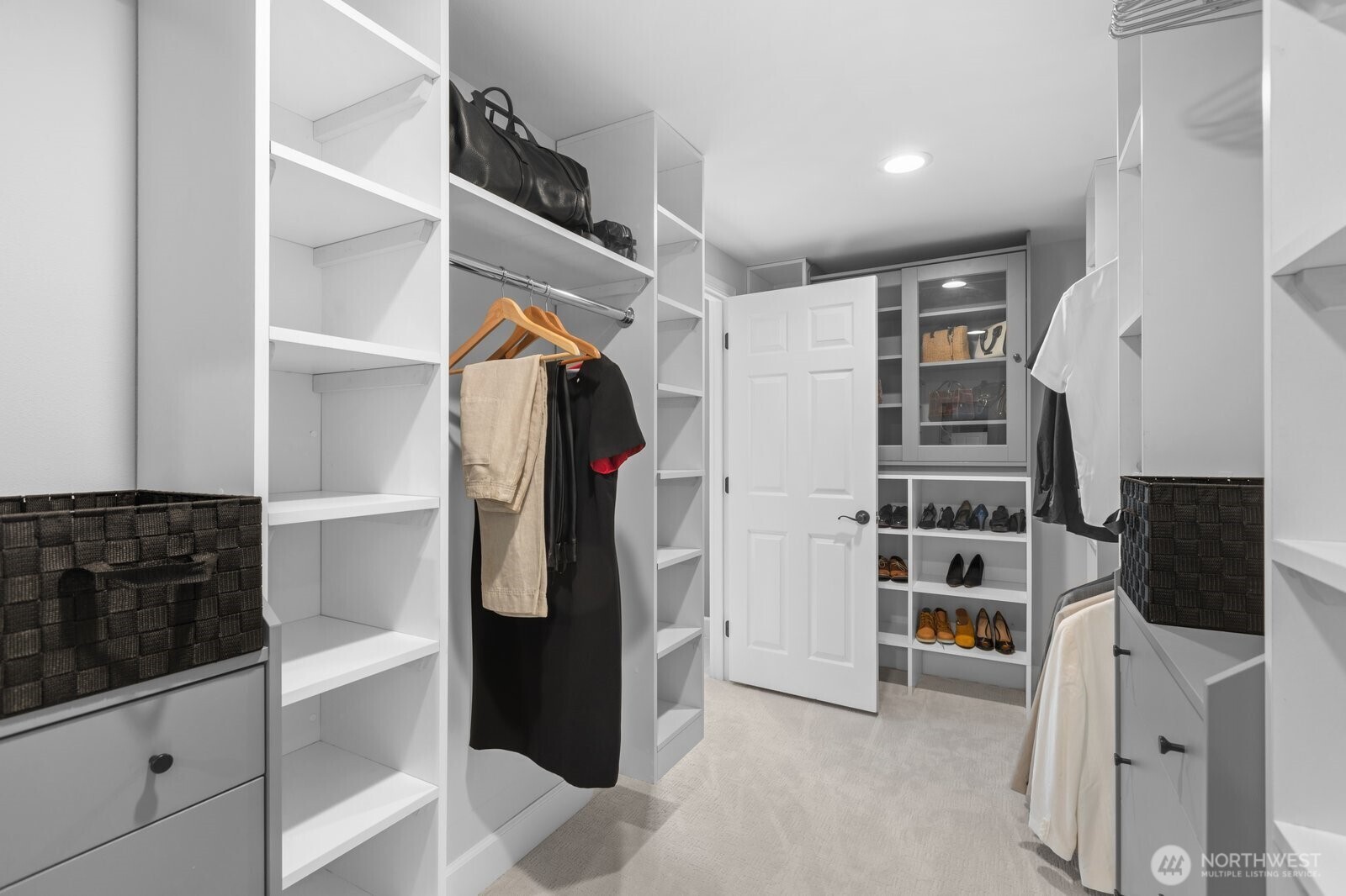 11404 239th Place Southwest Woodway, WA 98020 - Photo 20 of 40 a view of walk in closet with clothes and shoes